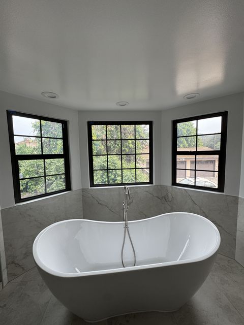 Electric switchable privacy glass windows tinted opaque in a West Covina bathroom