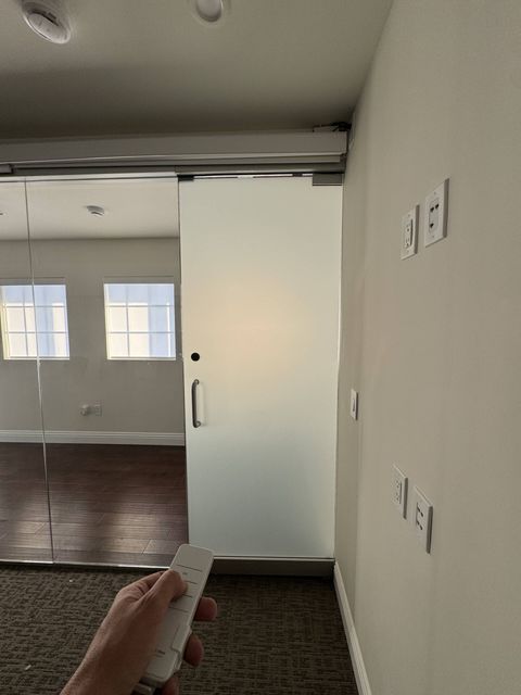Frosted privacy mode on a meeting room wall in a Hermosa Beach office