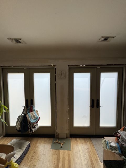Switchable french doors in frosted privacy mode in a Los Angeles residence
