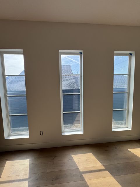 Smart glass windows Manhattan Beach — three street-facing living room windows in frosted state for on-demand privacy