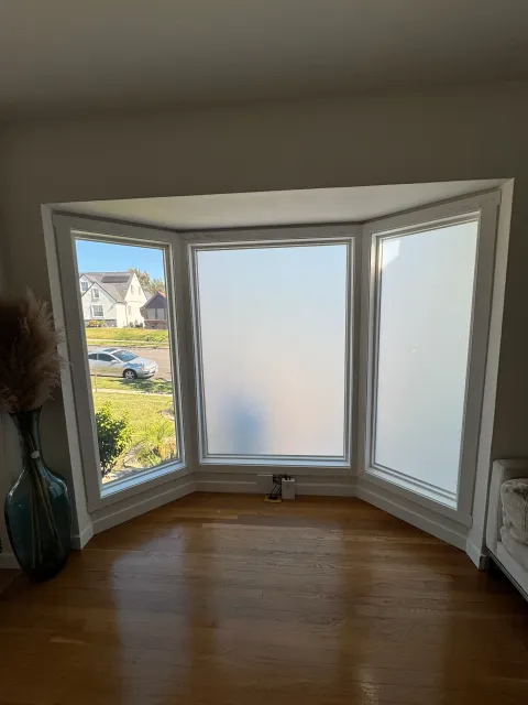 Three-panel residential bay window fitted with Smart View Smart Film in switchable mode