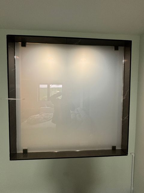 Switchable PDLC smart film install demonstrating proper driver placement and integration cabling for an oversized-glass project