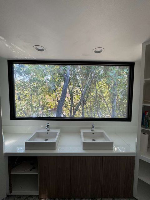 Large clear-mode glass window in an LA residential install showing daylight transmission and architectural-scale spec quality