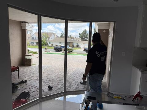 Curved sliding smart glass door installation in Lakewood CA