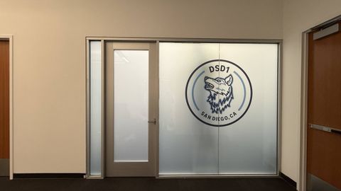 Smart glass office San Diego — two black-framed meeting rooms with PDLC switchable smart film by Smart View