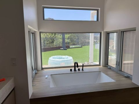 Bathroom window with smart film privacy installation in Agoura Hills CA