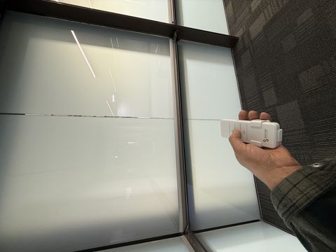 PDLC smart glass wall in Carlsbad CA conference room in frosted privacy mode