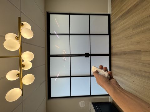 Smart glass sliding door Pasadena in frosted mode — 110 sqft PDLC panel switched to private state at a commercial office