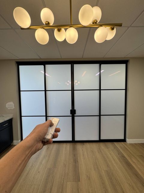 Smart glass sliding door Pasadena in frosted mode — 110 sqft PDLC panel switched to private state at a commercial office