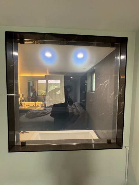Switchable film on a residential bathroom partition in frosted mode
