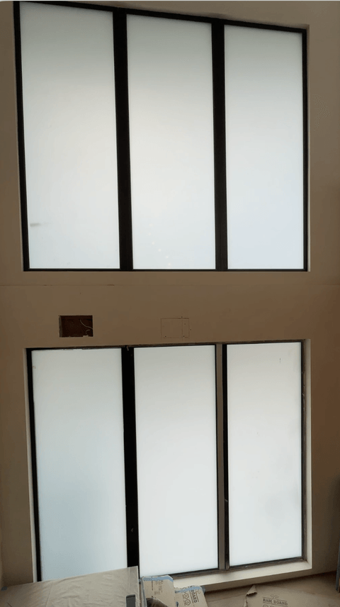 Smart glass windows Hollywood Hills install transitioning from clear to frosted at dusk