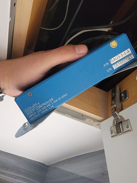 Gauzy driver replacement — technician installing a compatible replacement controller during smart glass technical repair and PDLC system service