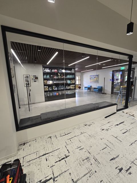 Glass-walled commercial space with switchable smart glass partitions in Calabasas