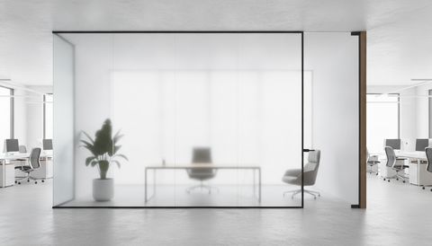Illustration of a glass-walled executive office seen from the open workspace, the wide panel of the glass front switched to frosted privacy while the door sidelight stays clear