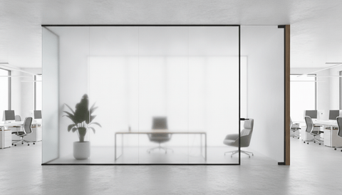 Illustration of a glass-walled executive office seen from the open workspace, the wide panel of the glass front switched to frosted privacy while the door sidelight stays clear