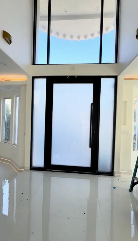 Smart glass front door in Beverly Hills home with frosted privacy mode