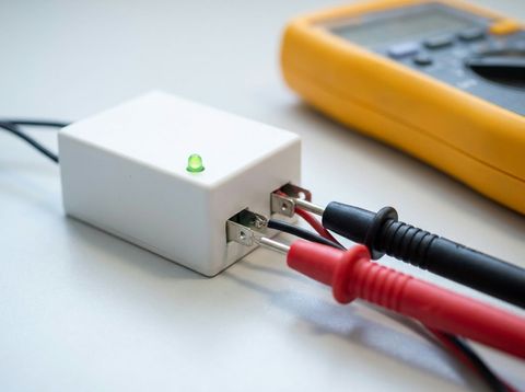 Testing a smart-film transformer's output terminals with a multimeter