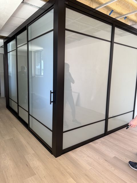 A frosted switchable smart glass conference wall in a Santa Barbara office, opaque for privacy