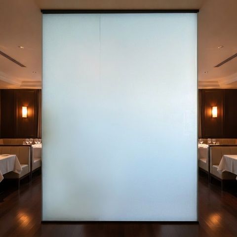 The same restaurant glass partition frosted opaque to create a private dining area