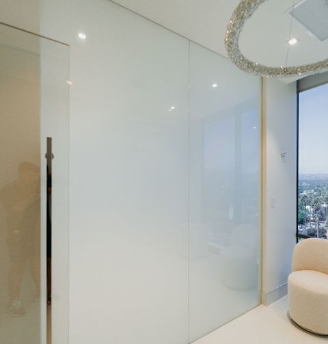 The same Beverly Hills glass wall switched to frosted privacy mode in under a second