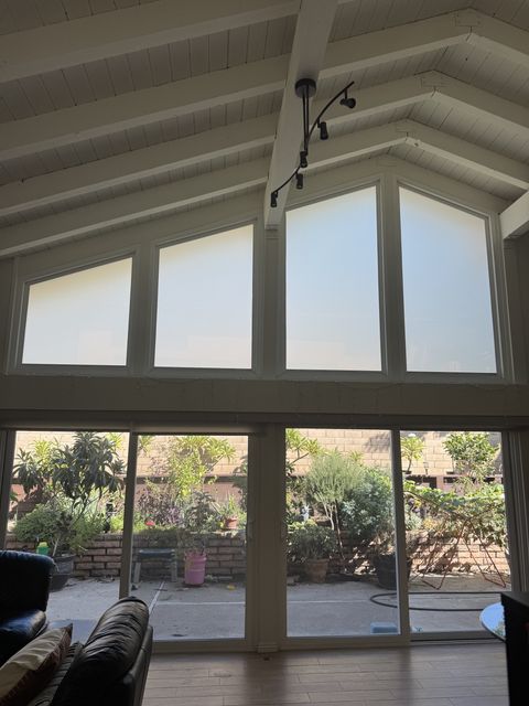 Smart film frosts all four Irvine gable windows to even white while daylight still enters