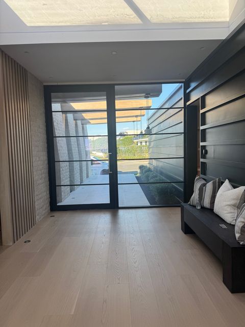 Newport Beach entry hall with the smart film front door clear, walkway and street visible
