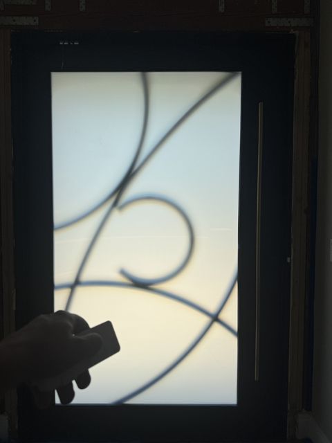 Smart View remote frosting the Rowland Heights front-door glass to solid white for instant privacy at the entry