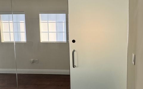 Frosted privacy mode on a meeting room wall in a Hermosa Beach office