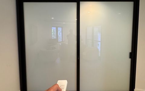 Smart glass home office walls in frosted privacy mode in Huntington Beach