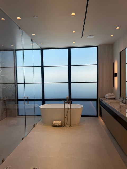Newport Beach bathroom smart glass window frosted to an even white, all nine lites private above the tub