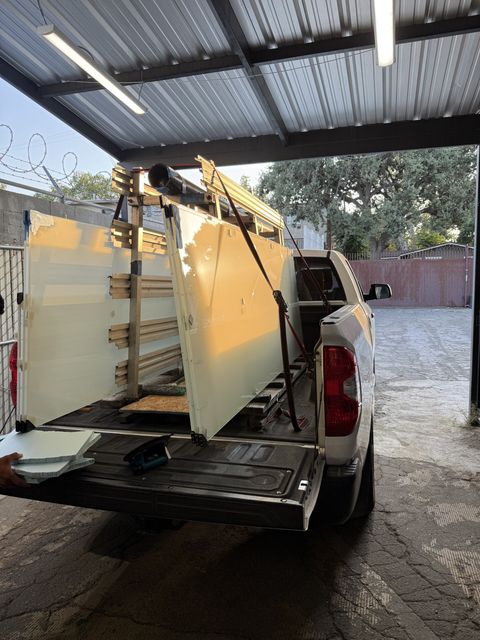 Finished smart glass panels racked and strapped in a Smart View pickup truck at the Canoga Park shop, loaded for delivery