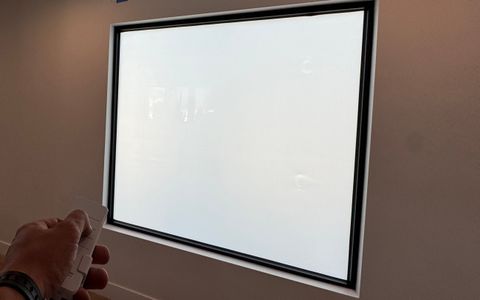 Smart glass picture windows in a Tarzana home in frosted privacy mode