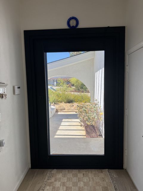 Wider view of the Topanga entry, door glass clear to the courtyard