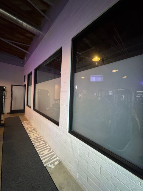 Frosted switchable smart film along a row of corridor windows in a Ventura commercial building