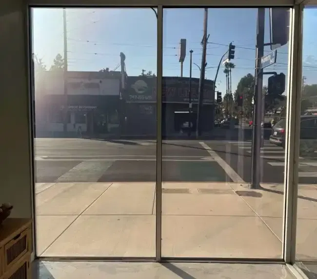 Switchable smart glass tips applied — storefront comparison showing how switchable smart film delivers privacy and UV protection in sunny LA environments after a quality consult-driven spec