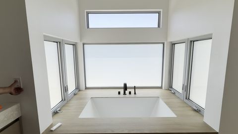 Agoura Hills bathroom windows around a tub turning frosted at a wall switch