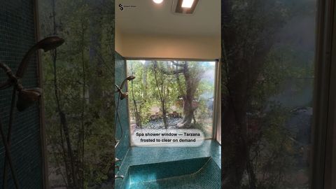 Tarzana full-height shower window switching from clear to opaque with smart film