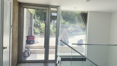 Pasadena glass front door and balcony panel switching to frosted privacy by remote
