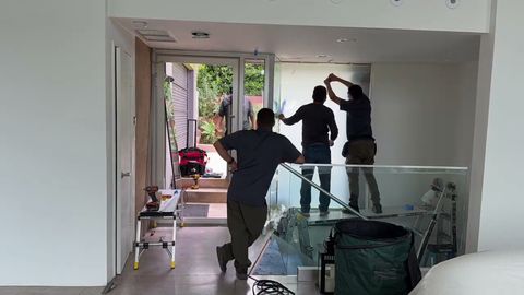 Smart View installers applying switchable smart film to an existing window