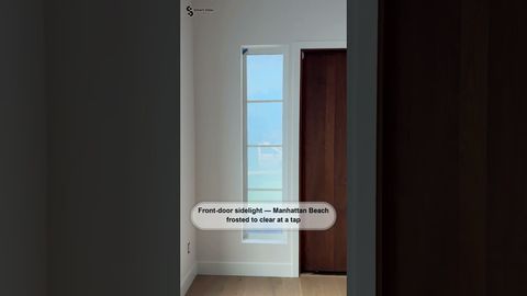 Manhattan Beach living room windows and front-door sidelight fitted with switchable privacy film