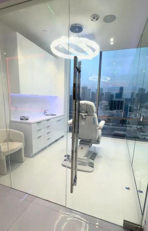 Smart glass medical room in Beverly Hills clinic with skyline view